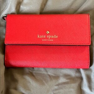 kate spade red leather crossbody clutch with gold logo